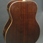 Rosewood back and sides with curly maple binding.