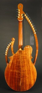 The top, back and sides are made from Hawiian Koa wood. The necks are made from mahogany and topped with ebony. The body and necks are trimmed in curly maple.