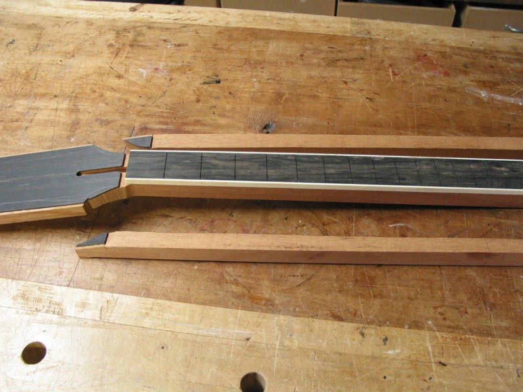 The neck has been cut to size and the fingerboard is made.
