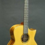 This Jumbo model was built as a fingerstyle performance guitar. It has a koa back and sides with a sitka spruce top and a sharp cutaway. Some comments from the owner after picking up his new guitar: