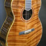 Curly redwood top with abalone purfling.
