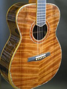 Curly redwood top with abalone purfling.